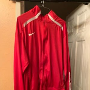 Large red Nike track jacket